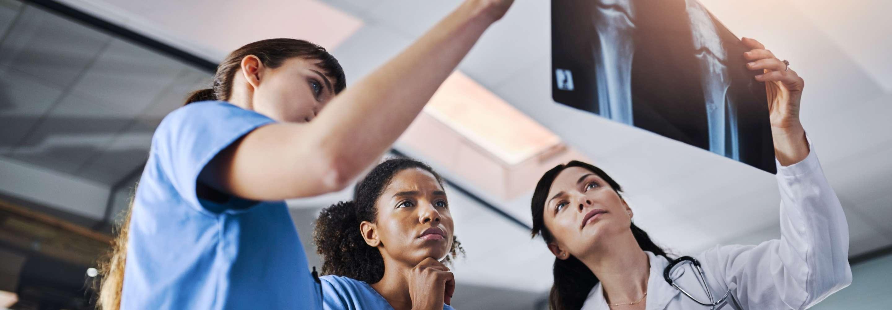 Radiologic technologist and Radiologist looking at a results from an xray