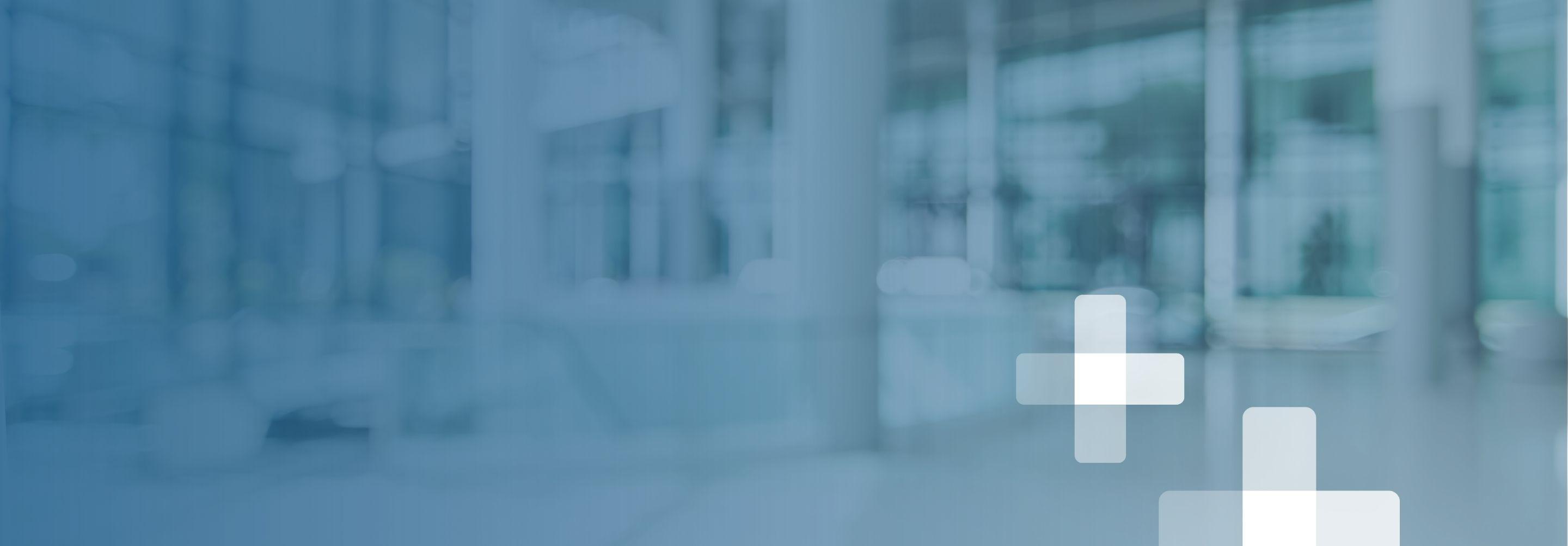 A loosely focused hospital interior with stylized white pluses superimposed over the background